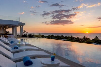 Rooftop infinity pool overlooking ocean at Montego Bay resort